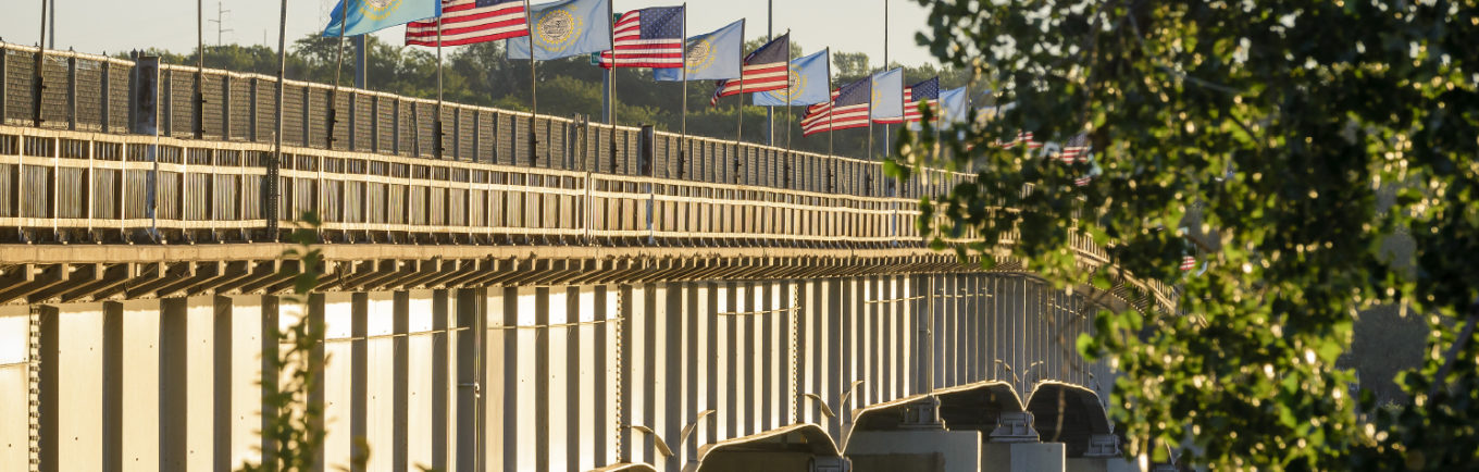 Bridge in Pierre Harrison Hill with flags