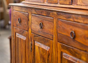 Wooden cabinet with drawers and handles - personal property coverage
