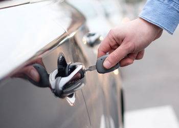 Unlocking car door with key - auto rental coverage from BankWest