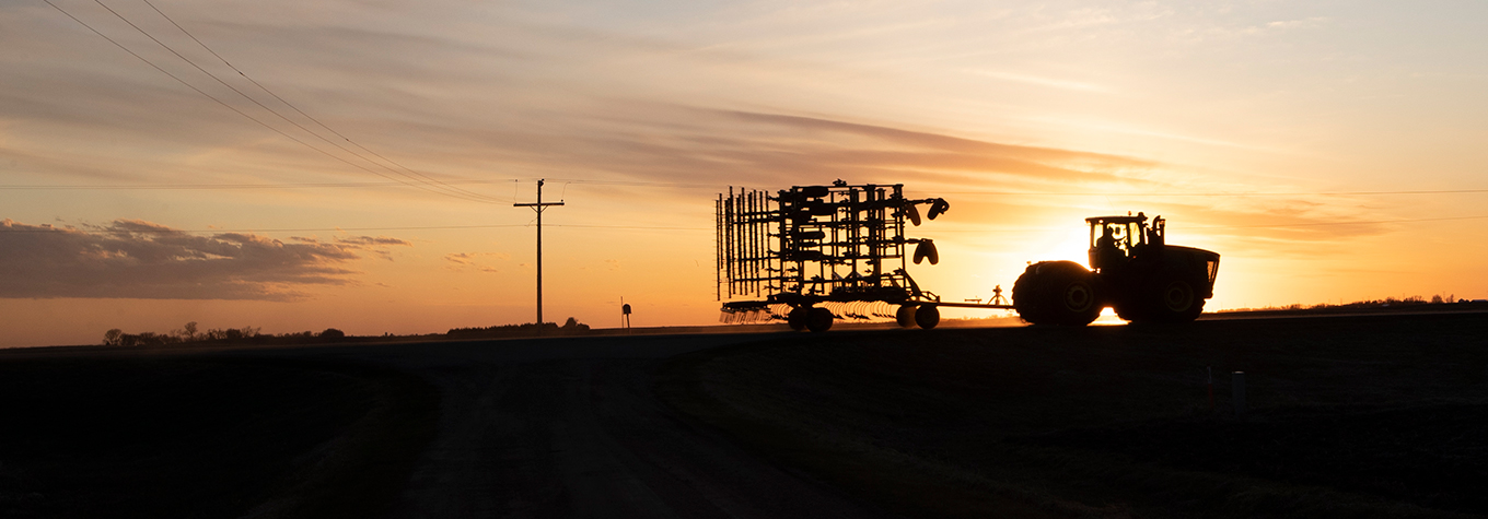 Tractor silhouetted against Madison South Dakota sunset